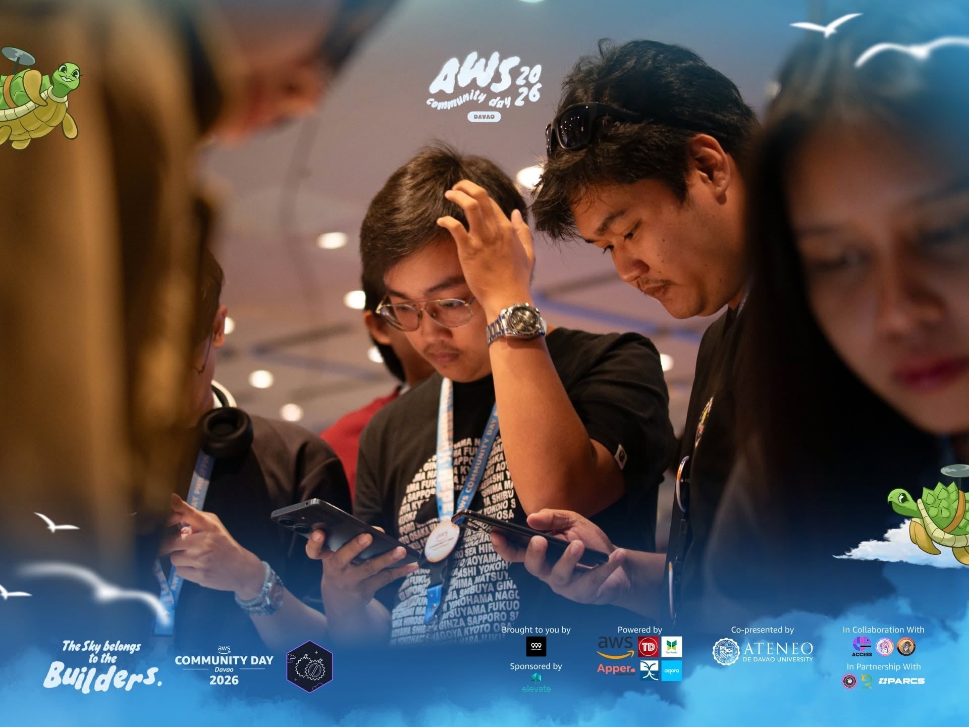 AWS Community Day attendees checking their phones